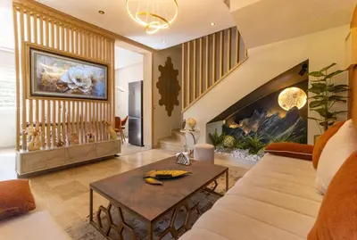 a living room with a couch and a fireplace at L Évasion ZEN Duplex d Exception Entre Plage et Serenite in Mohammedia
