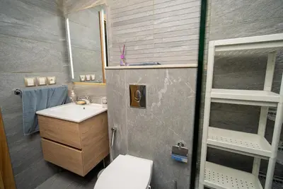 a small bathroom with a sink and a toilet at Welcome to Casa Luxe 3 King Beds Near CFC & Tram in Casablanca