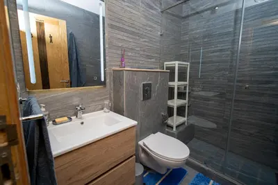 a bathroom with a sink and a toilet and a shower at Welcome to Casa Luxe 3 King Beds Near CFC & Tram in Casablanca