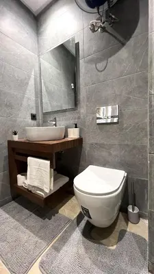 a bathroom with a white toilet and a sink at Appartement chic à Bourgogne Proche mosquèe Hassan II in Casablanca