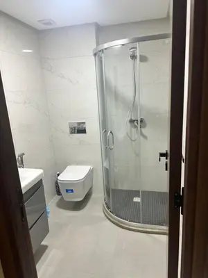 a bathroom with a shower and a toilet at Dar Bouazza getaway in Tamaris