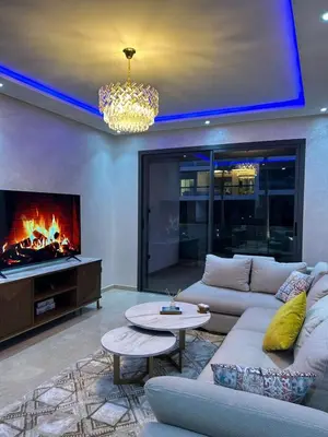 a living room with a couch and a fireplace at Dar Bouazza getaway in Tamaris