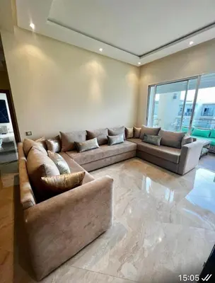 a large living room with two couches and a couch at Appartement de vacances CASABAY Sidi Rehal in Sidi Rahal