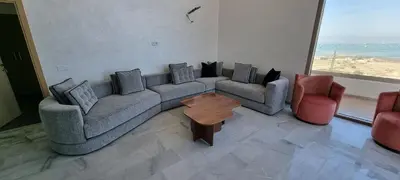 a living room with a couch and two chairs and a table at Duplex Zenata Tower in Aïn Harrouda