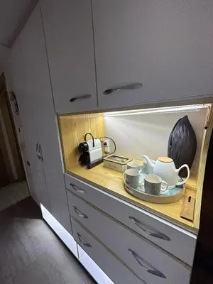 a counter with cups and saucers in a kitchen at Rock Island Appartement Haut standing pied dans l'eau Mohammedia in Mohammedia