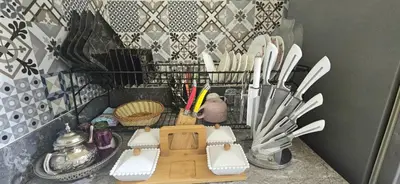 a bunch of knives and utensils in a holder at Quiet and Cozy Apartment in Casablanca