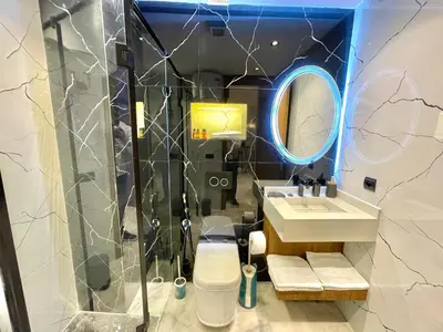 a bathroom with a sink and a mirror at Q11 Studio au Cœur de Casablanca Proximité et Confort in Casablanca