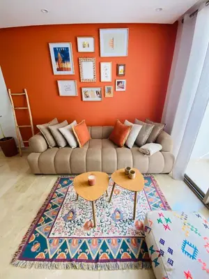 a living room with a couch and two tables at Zafiro - L'appartement de vos rêves - Casablanca in Casablanca