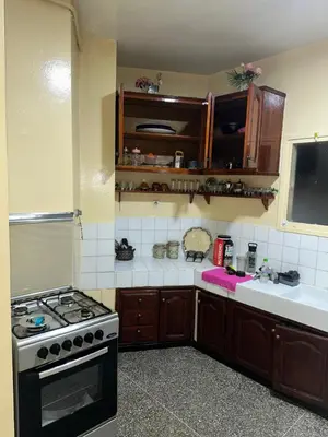 a kitchen with a stove and a sink at Chambre cosy au cœur de Rabat in Rabat