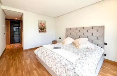 a bedroom with a large bed in a room at Appartment De Lux a California in Bali Luxury Residence in Casablanca