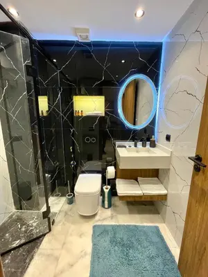 a bathroom with a sink and a mirror at C39 1BR Studio - Cozy & Central in Maarif in Casablanca