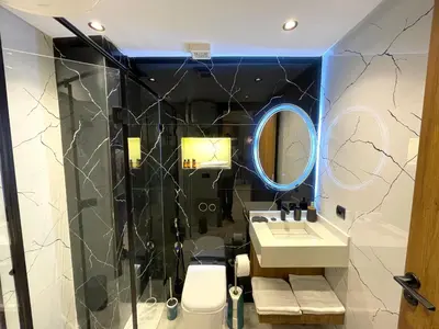 a bathroom with a sink and a mirror at C39 1BR Studio - Cozy & Central in Maarif in Casablanca