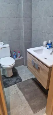a bathroom with a toilet and a sink at Cozy Guesthouse, Ain Sebaa, Casablanca in Casablanca