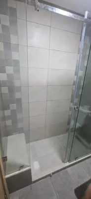 a shower with a glass door in a bathroom at Cozy Guesthouse, Ain Sebaa, Casablanca in Casablanca