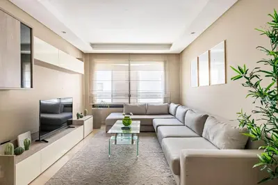a living room with a couch and a tv at TT holidays Casa Oasis in Casablanca