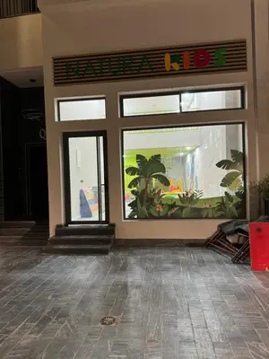 a store front with a big window with plants in it at Résidence Natura Living au parc in Mohammedia