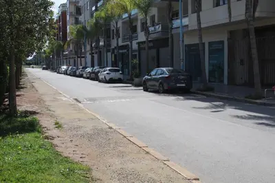 a street with cars parked on the side of the road at Studio cosy in Nouaceur