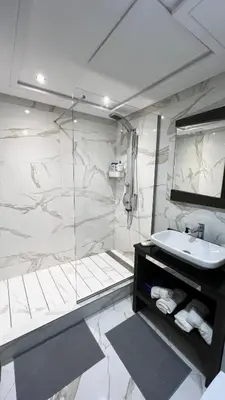 a bathroom with a sink and a shower at D2 L'Art de Vivre Urbain au Cœur de Casablanca maarif in Casablanca