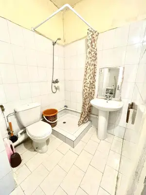 a bathroom with a toilet and a sink at Chambre Privée en plein centre de Rabat Agdal in Rabat