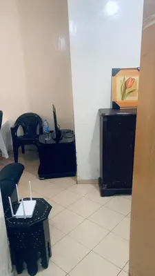 a room with a desk with a computer and a chair at chic chambre meublée in Casablanca