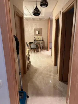 a room with a vacuum in the middle of a house at Résidence kettani piscine bouznika in Bouznika
