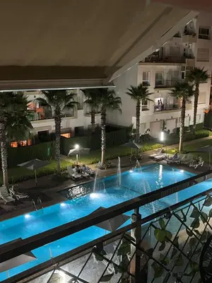 a view from the balcony of a hotel with a swimming pool at Résidence kettani piscine bouznika in Bouznika