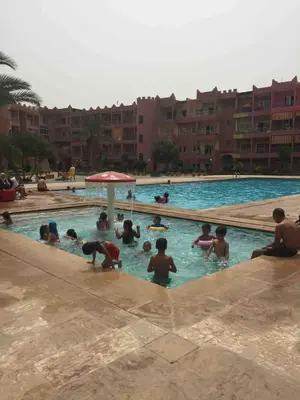 a group of people in a swimming pool at Sahara beach Mansouria in Mansouria