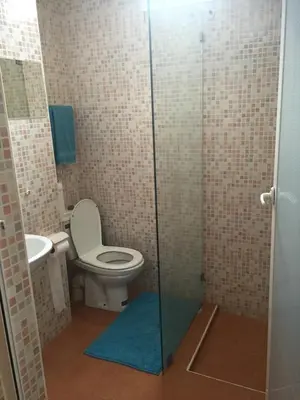 a bathroom with a toilet and a sink at Sahara beach Mansouria in Mansouria