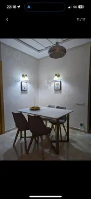 a dining room with a table and two chairs at Bouznika, Shems Kettani in Bouznika