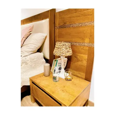 a bedroom with a bed and a table with a night stand at Bostay in Casablanca