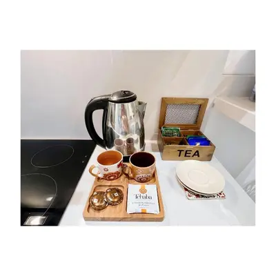 a tray with cups and a tea kettle on a counter at Bostay in Casablanca