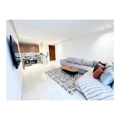 a living room with a couch and a table at Bostay in Casablanca