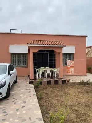 a car parked in front of a house at Villa Casablanca-Sidi Rahal à 5 min de la plage in Sidi Rahal
