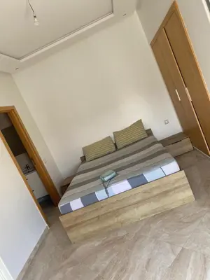 a small bedroom with a bed in a room at Casabay sidirehal in Sidi Rahal