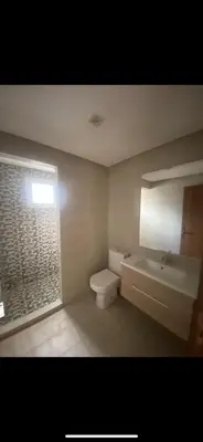 a bathroom with a sink and a toilet and a window at La résidence de Palais in Bouskoura