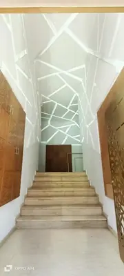 a staircase in a building with a white ceiling at La résidence de Palais in Bouskoura
