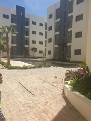 an empty courtyard in front of a building at Magic housse in Pont Blondin