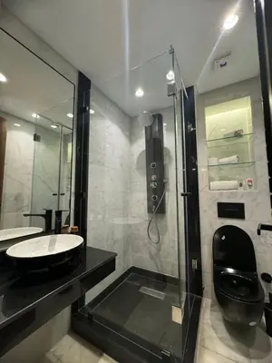 a bathroom with a toilet and a sink and a shower at Appartement de prestige à Casablanca in Casablanca