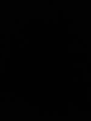 a dark room with a clock on the wall at Residence novodel in Aïn Harrouda