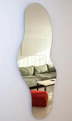 a living room with a couch and a red chair at Haut Standing 2-Bedroom Apartment in Gauthier in Casablanca