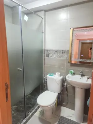 a bathroom with a toilet and a shower and a sink at Welcomeمرحبا in Casablanca