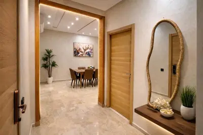 a hallway with a mirror and a dining room at Luxury 2Ch Face Plage 3 Piscines Jardin in Tamaris