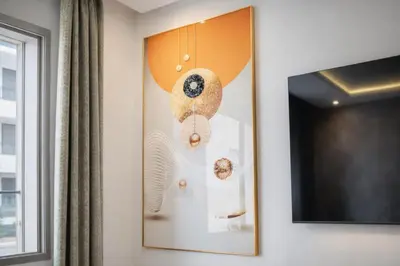 a wall with a painting of donuts on it at Luxury 1Ch Maarif Garage Fibre Netflix in Maarif