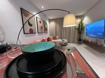 a living room with a bowl on a table at Luxury Residence So Stylish & Bright Appartement Hotel Au Coeur de Casablanca prés de Carrefour et 3 Min de La Gare Ferroviere Oasis in Casablanca