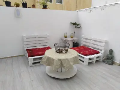 a room with two beds and a table with a table sidx sidx at Sweet Home in Maarif