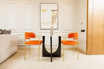 a dining room with a table and four chairs at Luxury 2BR Apartment in Agdal for a Relaxing Stay in Es Souissi