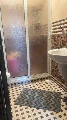 a bathroom with a shower and a sink at Appart meublé 5min de la plage à Bouznika in Bouznika