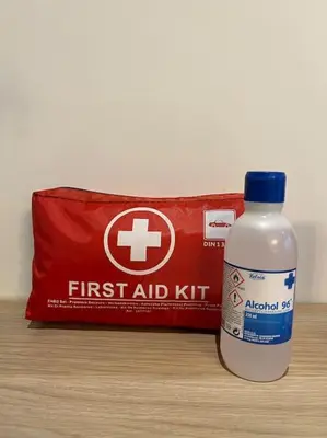 a bottle of first aid kit sitting next to a bag ofadobeadobeadobeadobe at Magnifique 2 chambres avec rooftop - Casablanca Centre in Casablanca