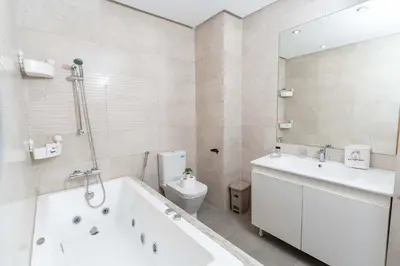 a bathroom with a tub and a toilet and a sink at Casa Streets 3 BR Terrace - AppartAli Luxury Platform in Casablanca