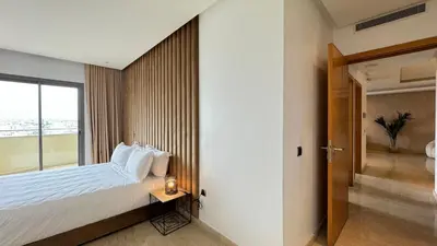 a hotel room with a bed and a window at Penthouse View 2BR Terrace - AppartAli Luxury Platform in Casablanca